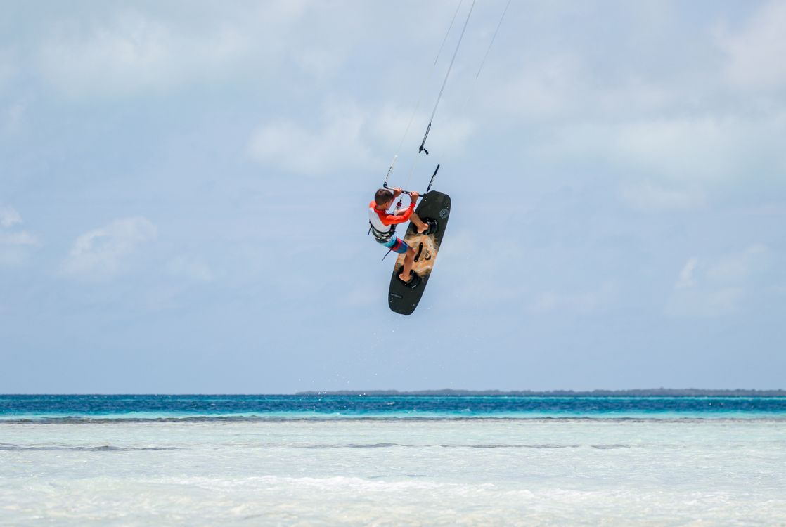 Kitesurfer in motion above the ocean